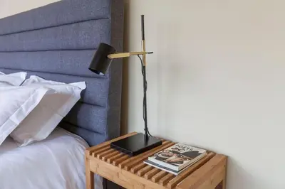 a bedroom with a large bed and a window at Le Chien Noir City Centre in Porto