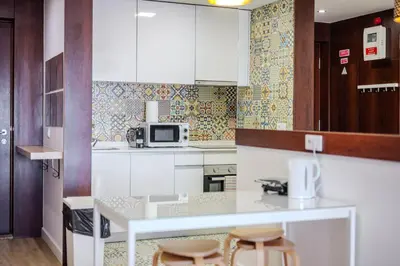 a bedroom with a bed with two towels on it at HEART OF THE CITY 1 ! in Vila Nova de Gaia