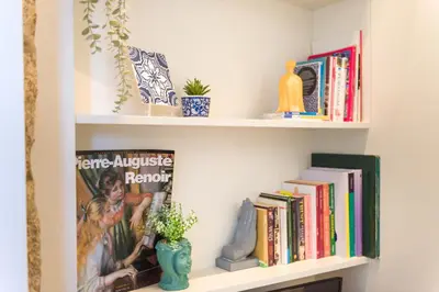 a book shelf filled with books and books at Casa Barros - Trindade in Porto