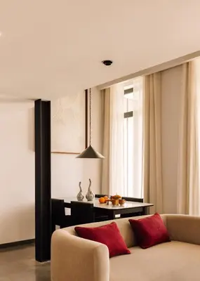 a living room with a couch and a table at The Rebello Hotel & Spa - Small Luxury Hotels Of The World in Vila Nova de Gaia