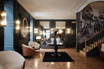 a gym with several tread machines in a room at GA Palace Hotel & Spa, a XIXth-Century Villa in Porto