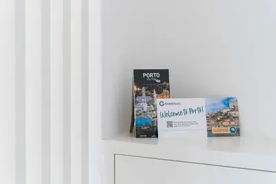 a book sitting on a counter next to a box at GuestReady - Almada 516 in Porto
