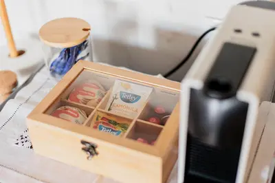 a wooden box with food in it on a desk at Ribeira Charming Apartment in Porto