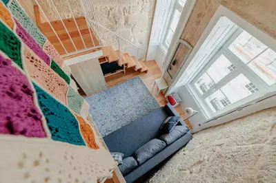 an overhead view of a living room with a couch at Ribeira Charming Apartment in Porto