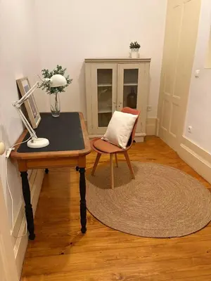 a white kitchen with a sink and a microwave at InLapa Studio IV Porto Garden View in Porto