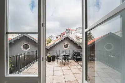an open window with a view of a balcony at GuestReady - Cosy in the Historic Heart of Porto in Porto