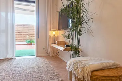 a room with a plant on the wall next to a door at CityLiving in Porto