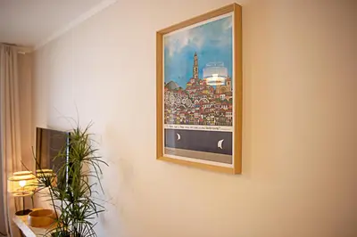 a painting of the eiffel tower on a wall at CityLiving in Porto