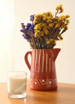 a vase with flowers next to a glass of milk at Villa Invicta 3 in Porto