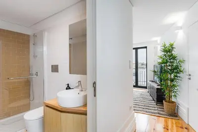 a bathroom with a sink and a toilet at Sunshine Luxury House Urban Retreat Downtown Porto in Porto