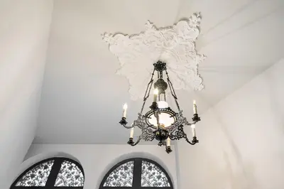 a chandelier hanging from a ceiling in a room at Sunshine Luxury House Urban Retreat Downtown Porto in Porto