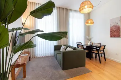 a living room with a couch and a table at Mouzinho da Silveira 215 by LovelyStay in Porto