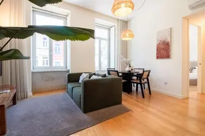 a living room with a couch and a table at Mouzinho da Silveira 215 by LovelyStay in Porto