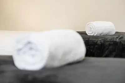 a couple of towels sitting on top of a bed at GuestReady - Enigma Apartments in Porto