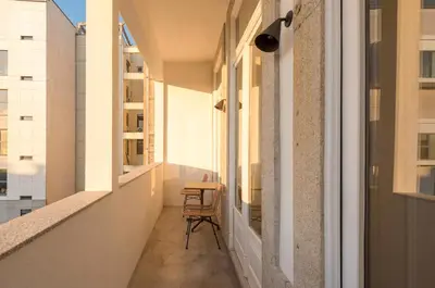 a living room with a couch and a table at Modern Charming Loft with balcony in central Porto by Lisbeyond in Porto