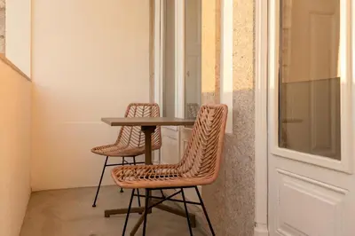 a group of people walking in a building at Modern Charming Loft with balcony in central Porto by Lisbeyond in Porto