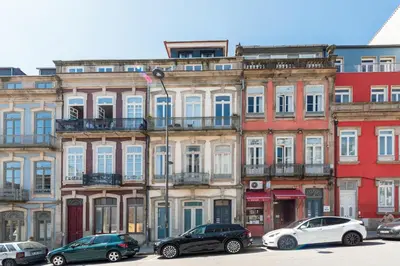 a city with white buildings and a clock tower at Modern Charming Loft with balcony in central Porto by Lisbeyond in Porto