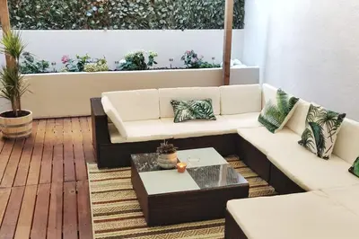 a living room with a couch and a coffee table at Two Bedroom Terrace Sanctuary in the Center in Porto