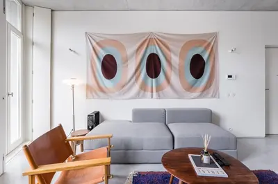 a living room with a couch and a table at GuestReady - The Modern Silveira in Porto