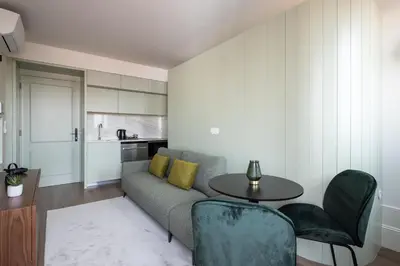 a living room with a couch and a table at ORM Portas Santa Catarina Apartments in Porto