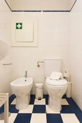 a bathroom with a toilet and a sink at BOUTIQUE Rentals- P*O*R*T*O Ribeira in Porto