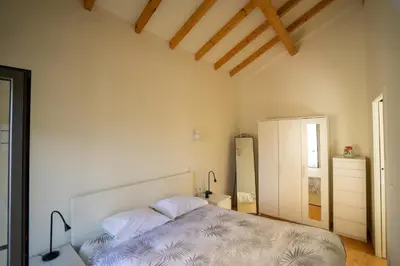 a bedroom with a bed with two pillows at Ilha Douro Duplex in Porto