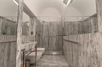 a bathroom with a tub and a sink and a toilet at Dream on - Clérigos Tower in Porto