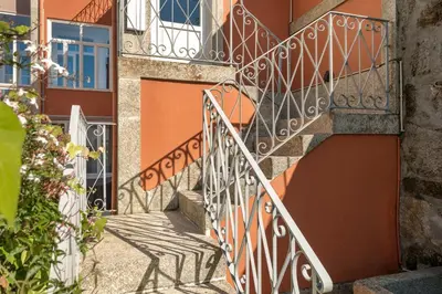 a set of stairs leading up to a building at MARKES · Lovely 1-bedroom home w/ sunny backyard in Porto