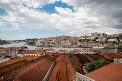 a view of a city with a river and buildings at Lovely 2BR w/ views over the river, parking incl in Vila Nova de Gaia