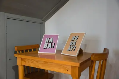 two signs on top of a wooden table at Panorama Apartments Porto Clerigos in Porto