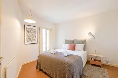 a bedroom with a large white bed in a room at Casa 128 by LovelyStay in Porto