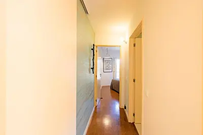 a hallway leading to a bedroom in a house at Casa 128 by LovelyStay in Porto