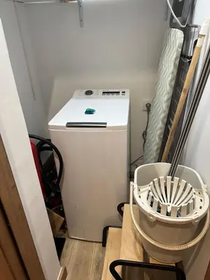 a small refrigerator in the corner of a room at Francisca City House in Vila Nova de Gaia