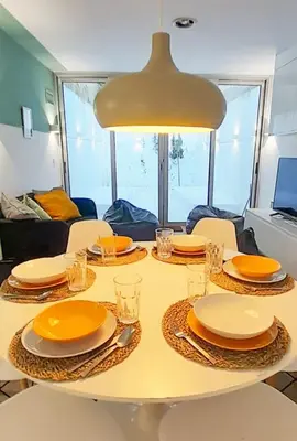 a table with plates and glasses on top of it at PORTO CONCEPT HOME - Campo Alegre in Porto