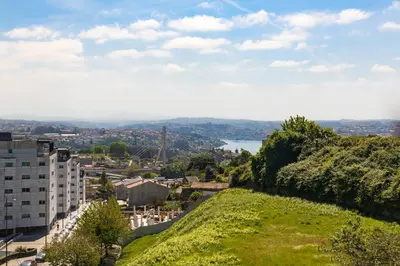 a view of a city from a hill at Dragão - Indigo Antas Park in Porto
