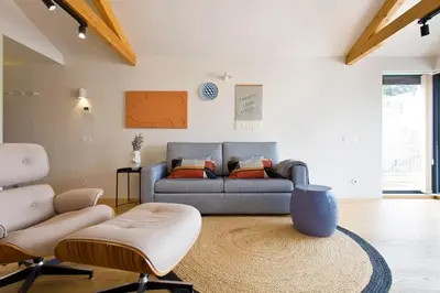 a living room with a couch and two chairs at Boutique Rentals-Primrose Terrace&Garage in Porto