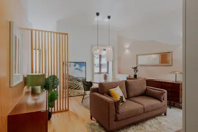 a living room with a couch and a table at Login Luxury Apartment in Porto