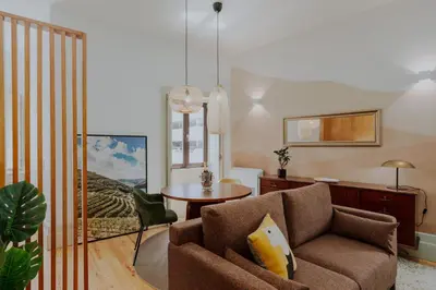 a living room with a couch and a table at Login Luxury Apartment in Porto