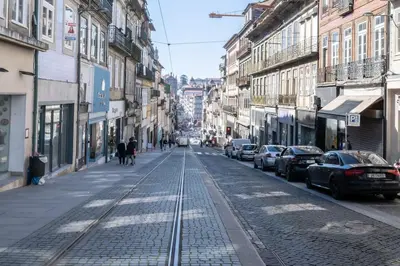 an empty city street with cars parked on the street at 31 de Janeiro Flat by Amber Star Rent in Porto