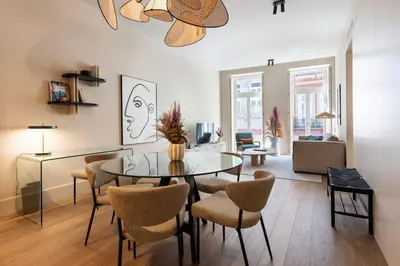 a living room with a glass table and chairs at Ando Living - Santa Catarina House in Porto