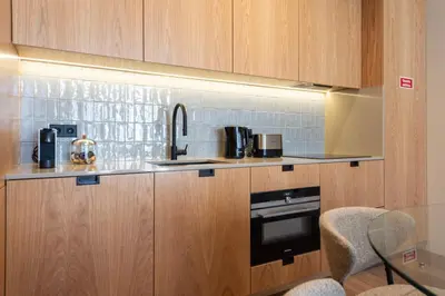 a kitchen with a counter with a sink and a stove at Ando Living - Santa Catarina House in Porto