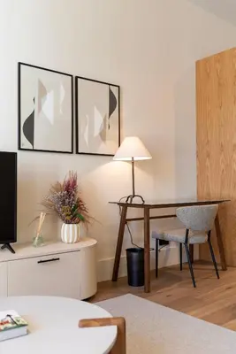 a living room with a table and a desk with a chair at Ando Living - Santa Catarina House in Porto