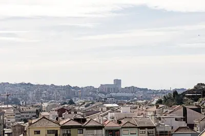 a view of a city with houses and buildings at Santos Pousada 1071 by LovelyStay in Porto