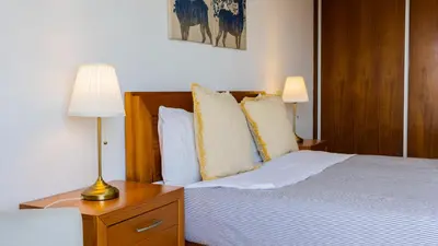 two towels sitting on top of a bed at Central Gaia Apartment by Unique Hosts in Vila Nova de Gaia